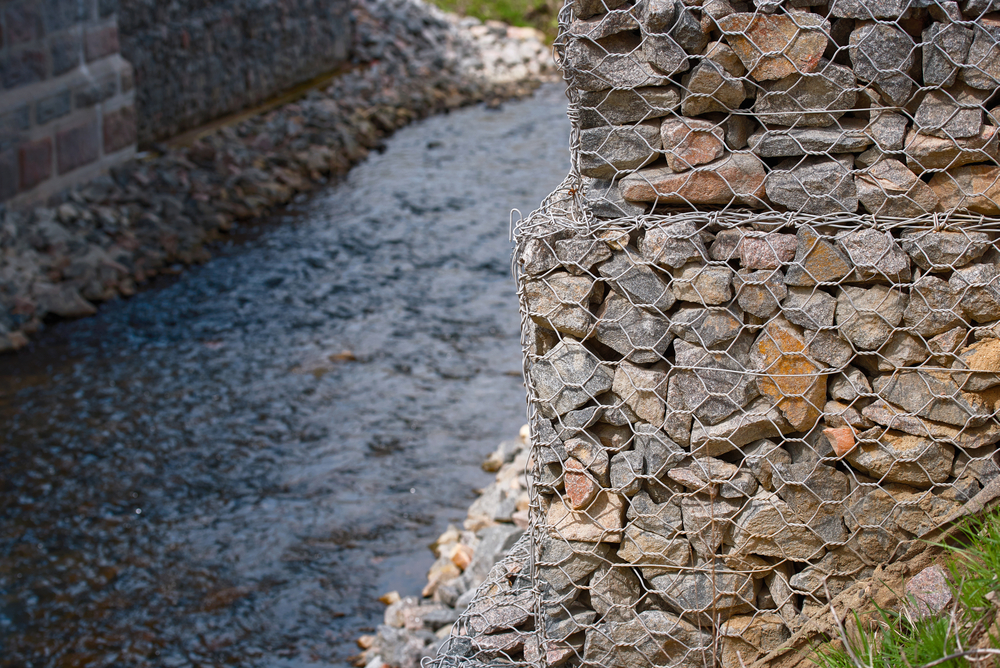 Gabion revetments provide a flexible and permeable coastal defense solution, ideal for reducing hydraulic pressure along riverbanks or shorelines. This method is commonly used in erosion control projects where durability and drainage are critical.